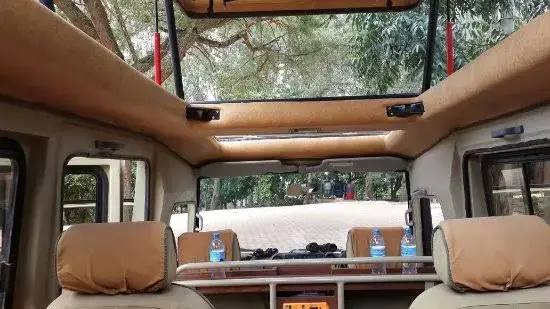 Inside a private safari vehicle with drinking water on board