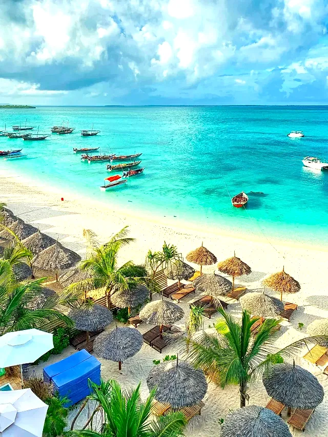 Turquoise water and boats off a Zanzibar beach